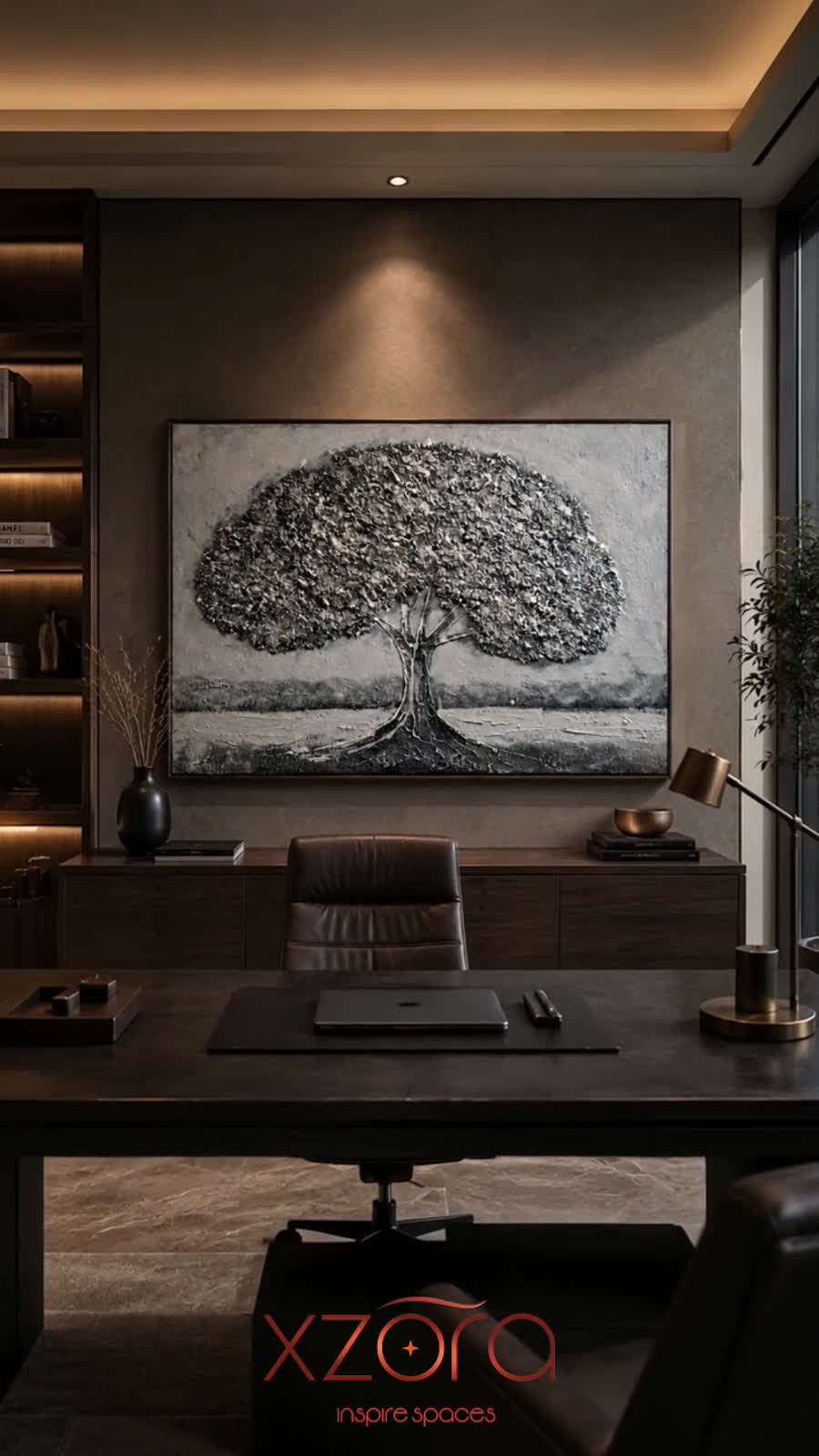 Silver tree piece above a desk in a dark private office